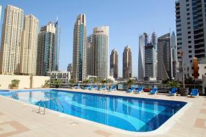 a large swimming pool on the roof of a building at Beautiful Marina Views One Bedroom Apartment with two balconies in Dubai