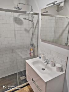 a white bathroom with a sink and a shower at CRAFT HOME Ponteceso Camiño dos Faros in Ponteceso +17 photos