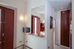 Televízia a/alebo spoločenská miestnosť v ubytovaní Apartamento Puerta del Arenal - Kainga Homes