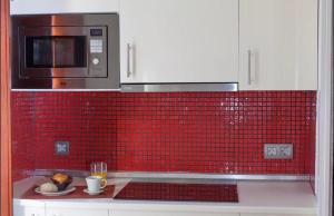 Kuchyňa alebo kuchynka v ubytovaní Apartamento Puerta del Arenal - Kainga Homes