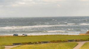 a beach with a couple of boats on it at Poseidon's Inn in Lossiemouth