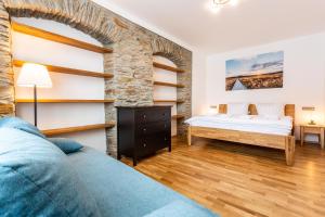 Postel nebo postele na pokoji v ubytování U Pivovaru - Apartments Boží Dar