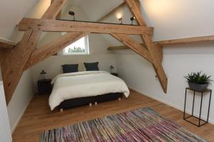 Postel nebo postele na pokoji v ubytování B&B 't Burreken