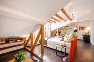 a bedroom with a bed and a table at Lisbon Wine House - Rooms & Suites in Lisbon