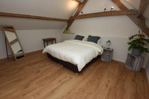 Postel nebo postele na pokoji v ubytování B&B 't Burreken