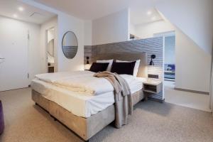 Voodi või voodid majutusasutuse maakt Hotel toas