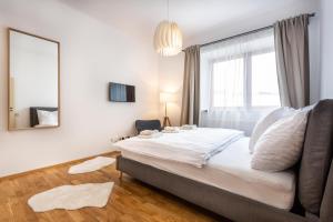 Postel nebo postele na pokoji v ubytování U Pivovaru - Apartments Boží Dar