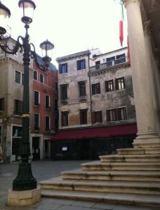 a street light in a city with buildings at Appartement Fenice II A in Venice