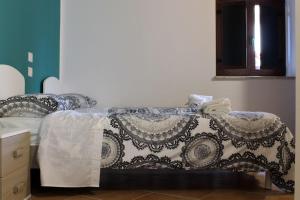 Postel nebo postele na pokoji v ubytování Albergo Diffuso di Campolattaro