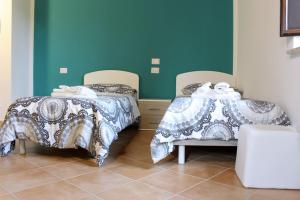 Postel nebo postele na pokoji v ubytování Albergo Diffuso di Campolattaro