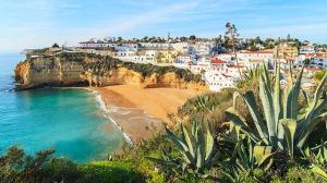 a view of a beach with houses and the ocean at Vila Paz in Carvoeiro