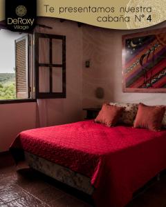 Ένα ή περισσότερα κρεβάτια σε δωμάτιο στο DeRoxy Village