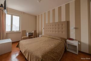 Voodi või voodid majutusasutuse Albergo Bagner toas