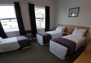 Postel nebo postele na pokoji v ubytování Masonic Hotel