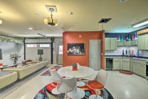 a kitchen and living room with a table and chairs at Chalet at Falling Water Close to Bike Trails in Bella Vista