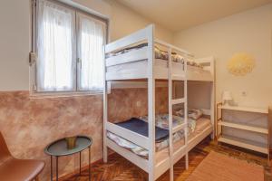 En eller flere senger på et rom på Q PODGORICA Beds,Rooms and more