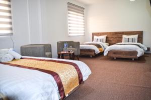 Postel nebo postele na pokoji v ubytování Hikaya studios