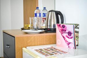 a table with a bottle of water and a box on it at Hikaya studios in Wadi Musa