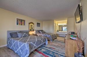a hotel room with two beds and a television at Margaritaville Resort Golf Course Oasis with Hot Tub in Osage Beach