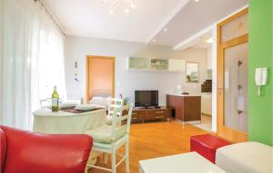 a living room with a table and a dining room at 1 Bedroom Amazing Apartment In Rijeka in Rijeka