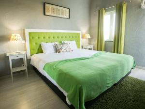 Säng eller sängar i ett rum på Quinta dos I's - Algarve