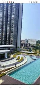 a large pool of water in front of some buildings at Hyve Soho Suite - Netflix in Cyberjaya