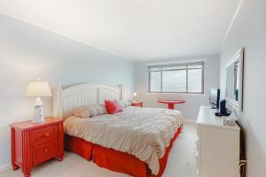 a bedroom with a bed and a television in it at Ocean Towers 3A in Ocean City