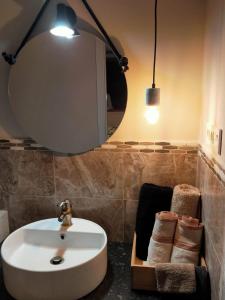 a bathroom with a sink and a mirror at Casa Francesca Altea piscina y aparcamiento privado in Altea