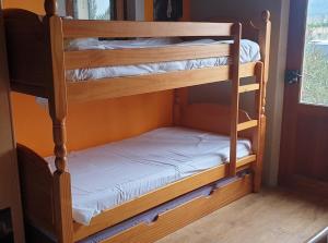 a couple of bunk beds in a room at Villa avec piscine 14 couchages in Charleval