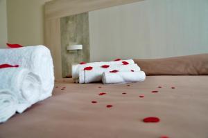 Posteľ alebo postele v izbe v ubytovaní Hotel Roscianum Welness SPA