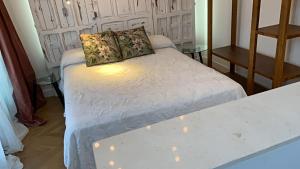 A bed or beds in a room at CASA NAIA Santa Rufina 7