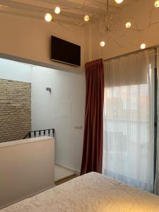 A bed or beds in a room at CASA NAIA Santa Rufina 7