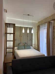 A bed or beds in a room at CASA NAIA Santa Rufina 7 Még 32 kép