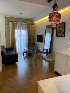 A television and/or entertainment centre at CASA NAIA Santa Rufina 7