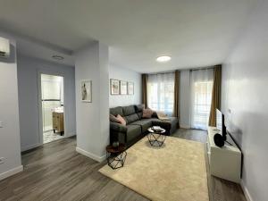 a living room with a couch and a table at CASA SOHO Y ALEX in Estepona
