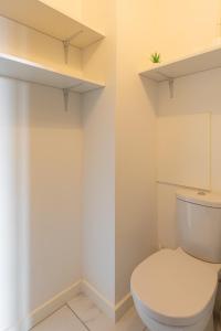 a bathroom with a white toilet in a room at DIFY Bollier - Quartier Gerland in Lyon +5 photos