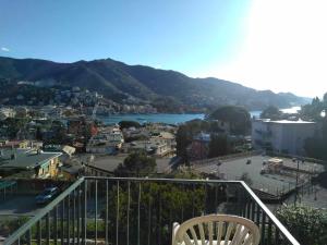 a balcony with a view of a city and a river at Eurotel 406 in Rapallo