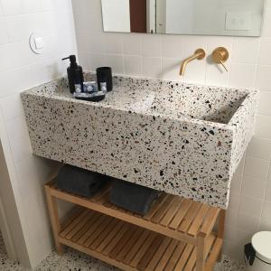 a bathroom with a sink and a counter at Enjoy Lisbon Carcavelos in Carcavelos