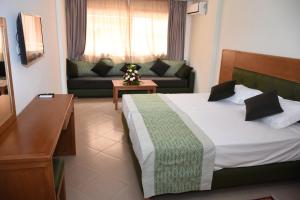 Postel nebo postele na pokoji v ubytování Hotel Residence Imiplage