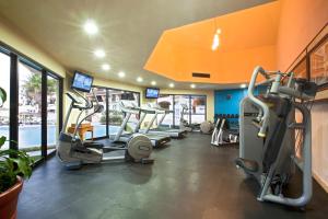 a gym with several treadmills and cardio machines at Emporio Cancun - Buy All Inclusive Option in Cancún