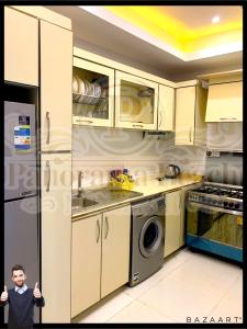 A kitchen or kitchenette at شقق بانوراما شاطئ الأسكندرية كود 9