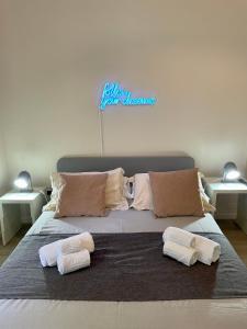Postel nebo postele na pokoji v ubytování 4 Balconi rooms Paladini B&B e appartamenti
