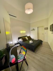 TV a/nebo společenská místnost v ubytování 4 Balconi rooms Paladini B&B e appartamenti