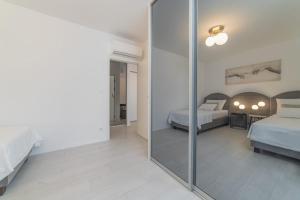 Posteľ alebo postele v izbe v ubytovaní Perla Luxury Apartment