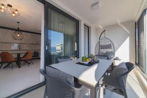 Posedenie v ubytovaní Perla Luxury Apartment