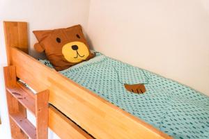 a teddy bear sitting on top of a bunk bed at La Colina Retreat - Vacation STAY 07213v in Madarao Kogen