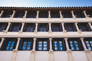 a facade of a building with windows at Apartamento Corredera in Córdoba