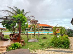 a resort with a swimming pool and a garden at Sistcep Praia Hotel in Luis Correia +32 photos