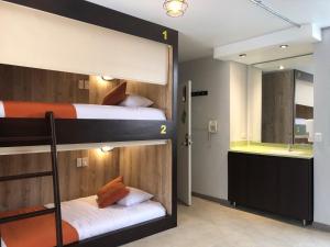 Postel nebo postele na pokoji v ubytování Hotel Juliette Bogota