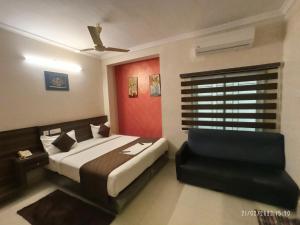 Ένα ή περισσότερα κρεβάτια σε δωμάτιο στο Hotel I-Way Residency Perungudi